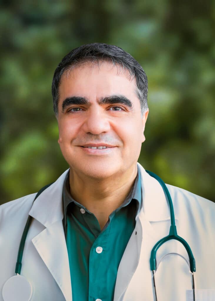 Dr. Michel Farah smiling and wearing a stethoscope, set against a green background.
